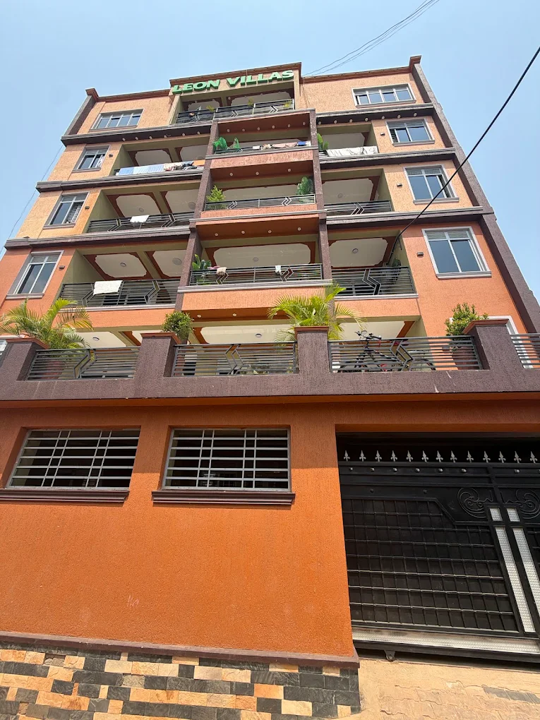Leon Villas from the street, with open balconies stepping up the front